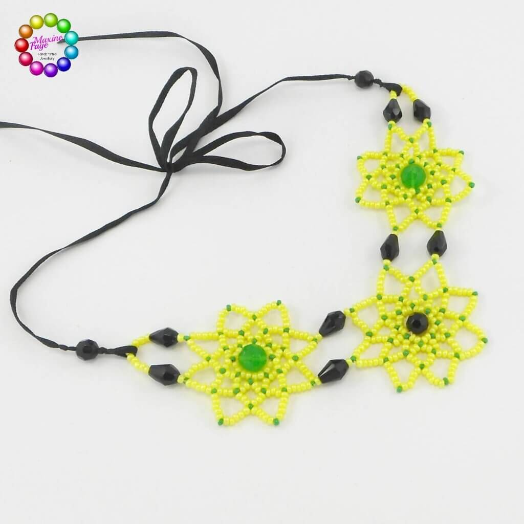 Ribbon style tie clasp on beaded flower necklace